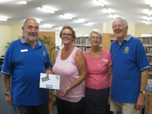 Rotarian Ray Harrison, Rotary President Geoff Latona, Librarian Christine Shelly and Library Volunteer Di Vercoe.
