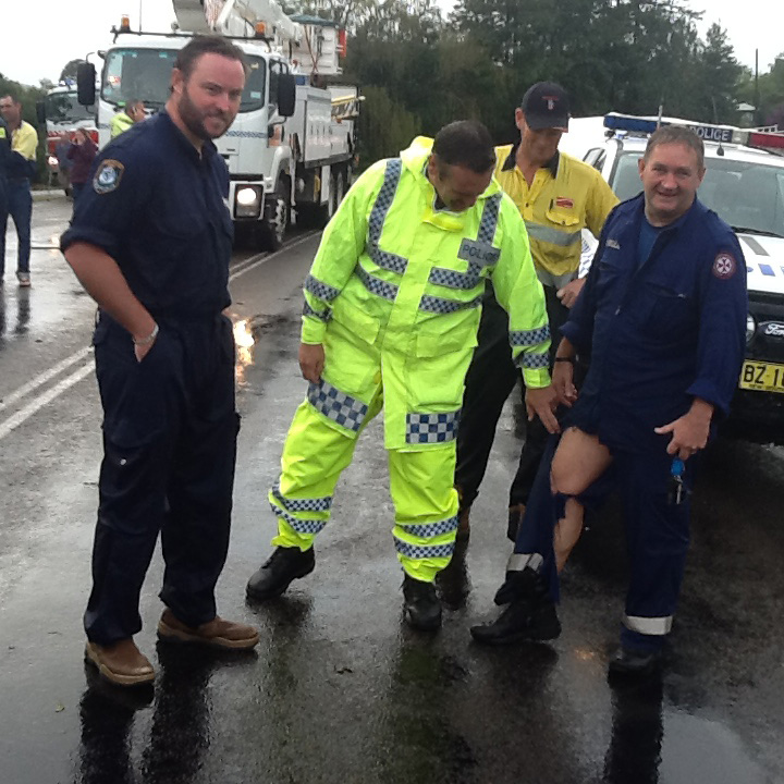 Senior Constable Brad Smith and police rescue examine Bill Rathbone's torn trousers  copy