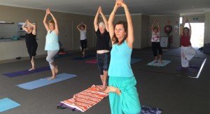  The ladies in class showing good Yoga form while raising money for Laos children.