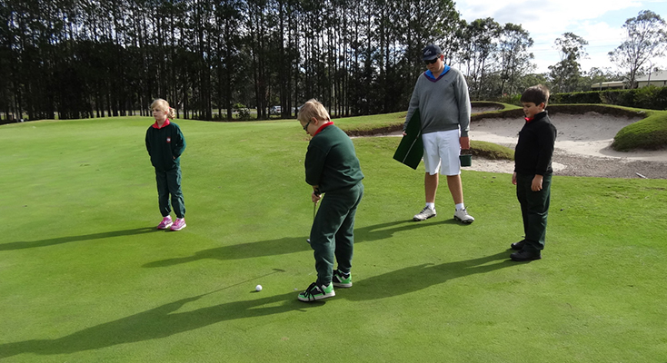 Bobs Farm students receiving putting tips