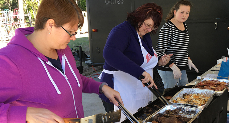 Volunteers supplying democracy sausages to voters, Michelle Cieplechowicz,, Belinda Beasley, and former Wirreanda PS student Isabella Kennedy.