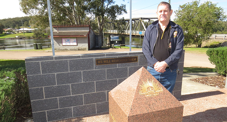 TRIBUTE: Karuah RSL Sub Branch President Mr Peter Fidden at the new Commemorative Wall.  