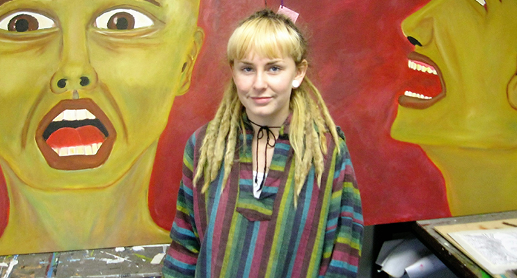 ARTWORK: Charli Burns with her painting “Fear of Oneself.”