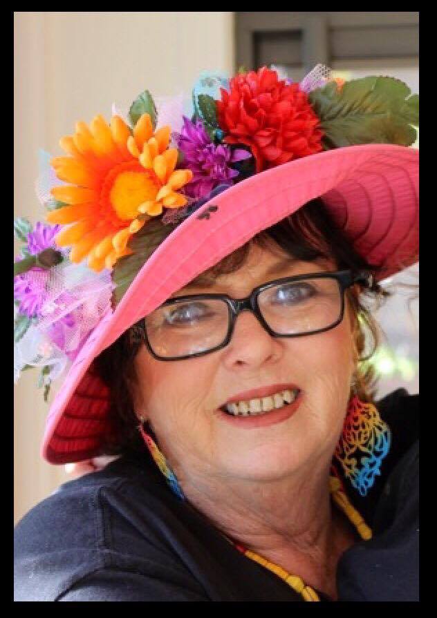 Judi Walker in her well known flower hat.  (Courtesy of Jewell Drury)