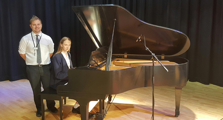 PERFORM: Emily Legge with music teacher Mr Brendan Wright. 