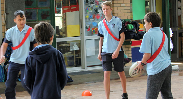 SPORT: BCS Year 10 student Luke Rochester referees a game. 