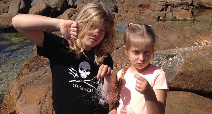 Luke and Sophie Stanhouse with the fishing wire they found. 