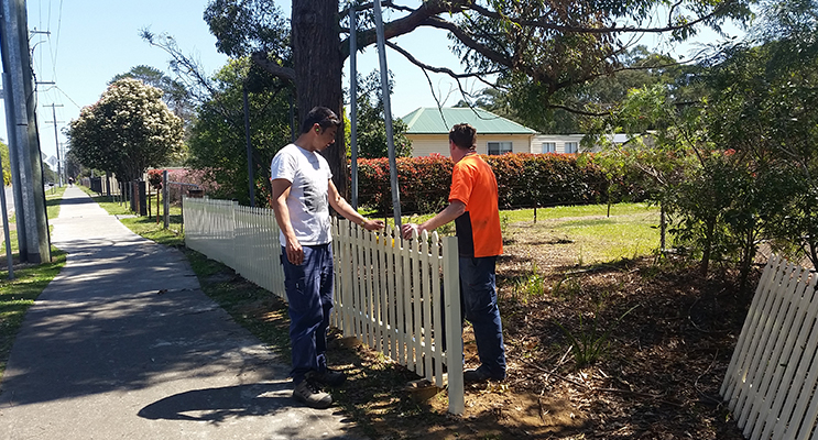 2.Volunteers working on the fence construction 