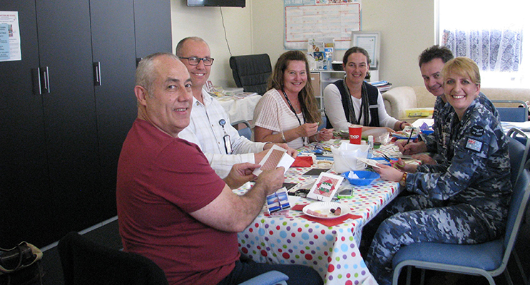 Members of Williamtown Craft Group working on their important Christmas craft 