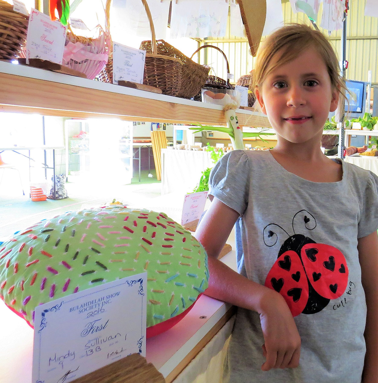SEWING: Six-year old Mindy Sullivan with her award-winning needlecraft
