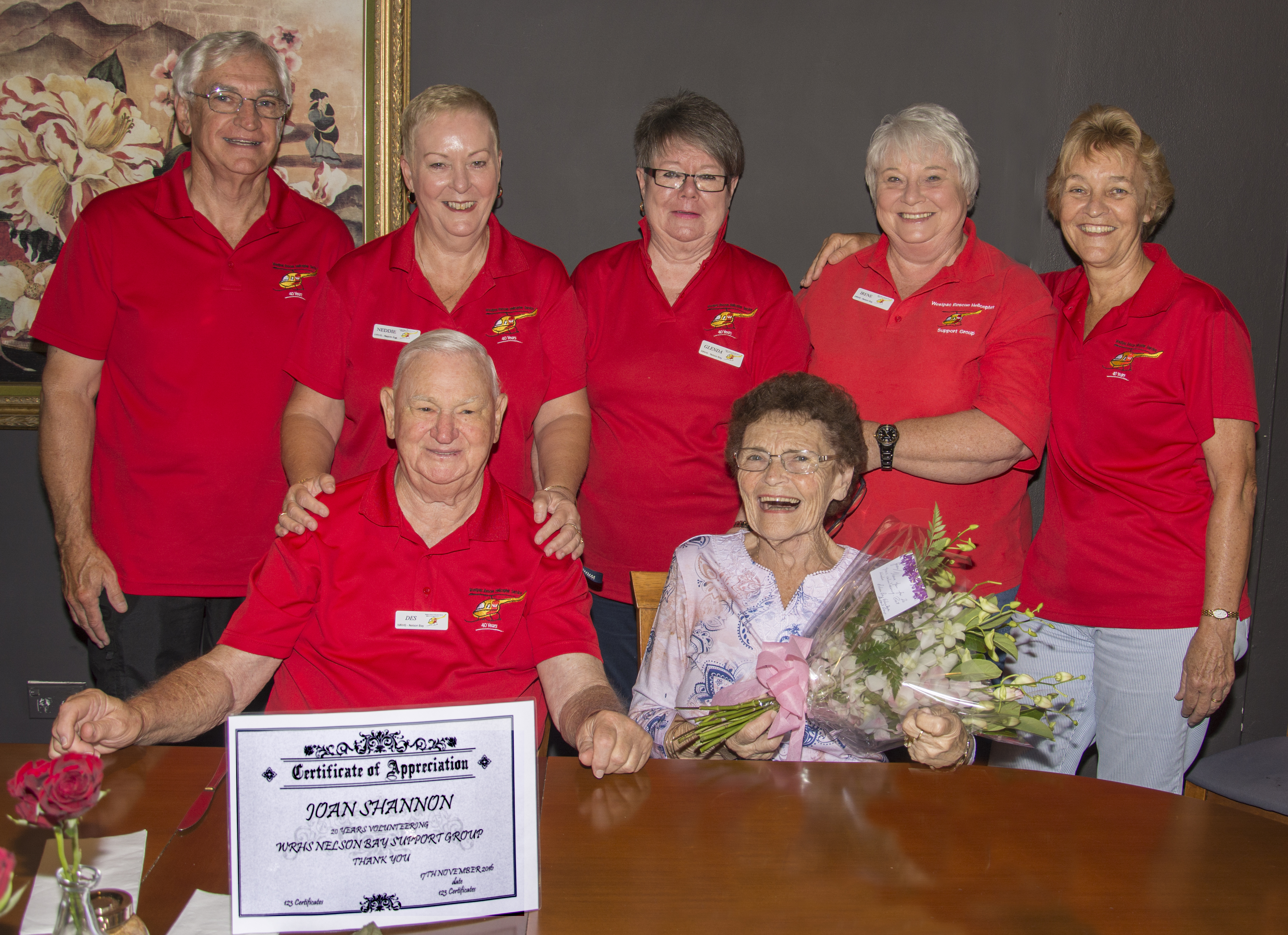 Joan Shannon surrounded by dedicated Westpac Helicopter volunteers. Photo by: Square Shoe Photography