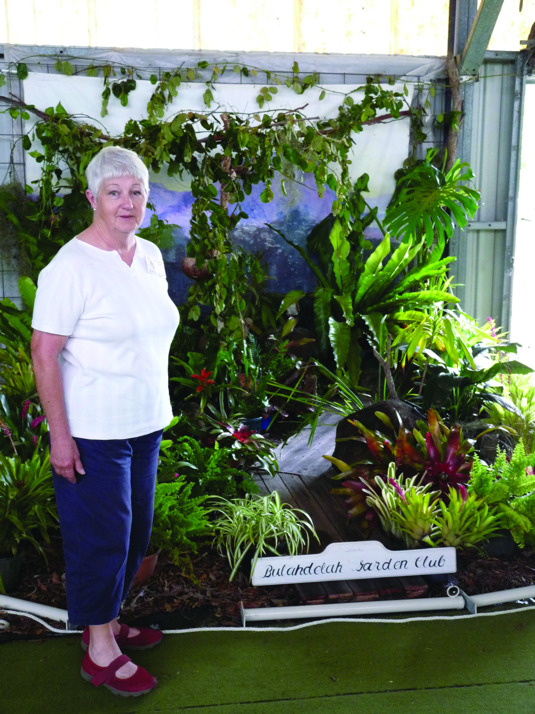 President Loretta Simpson admiring the club's display.