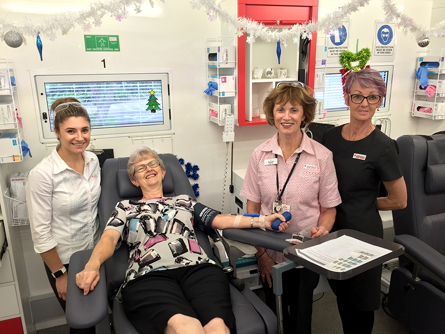 Libby Dingle donating her time to donate blood, assisted by nurses Kristina Cooper, Kerry Wood and Cynthia Bailey at the Mobile blood bank in Medowie this week.