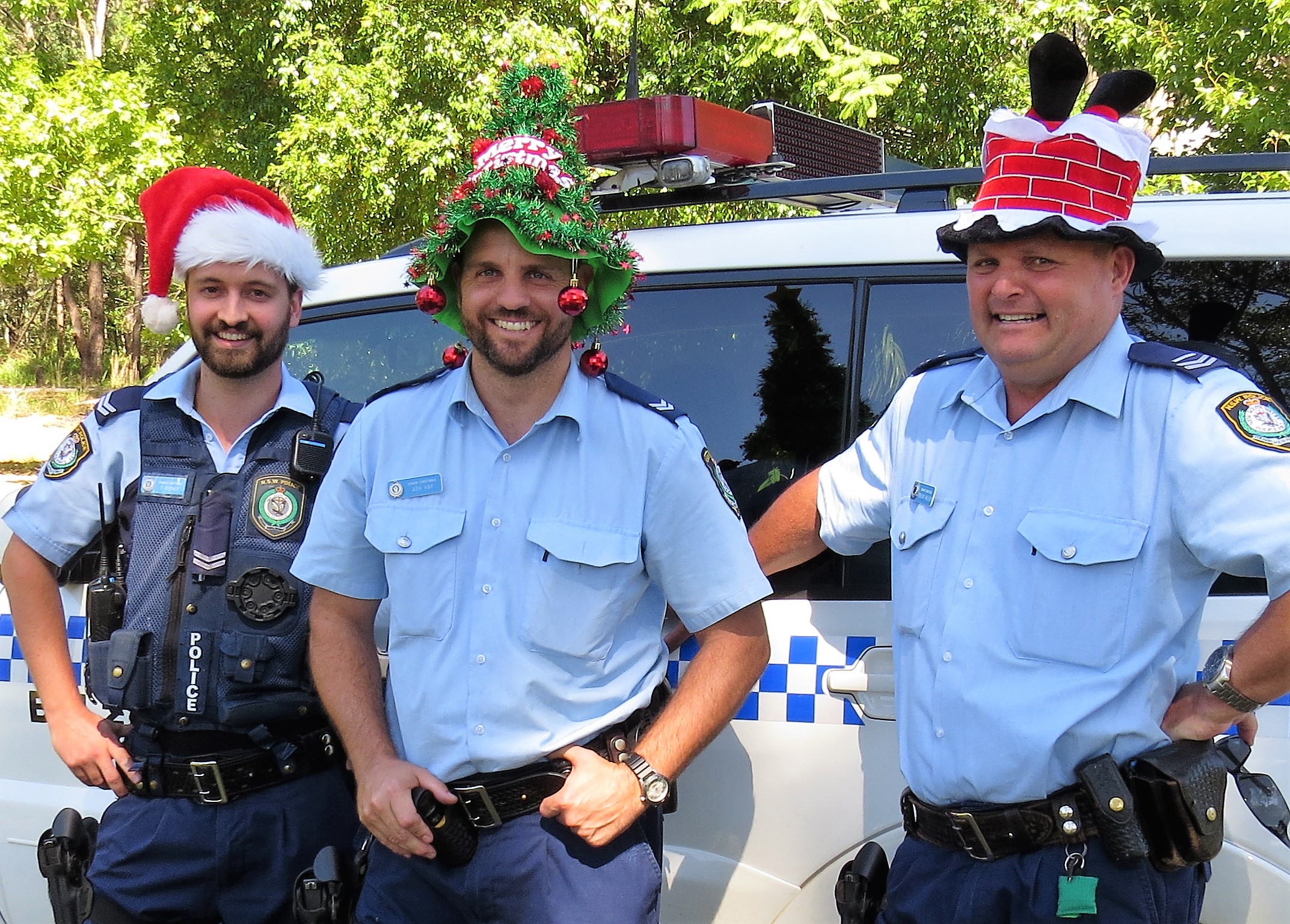 SEASONS GREETINGS: Police Senior Constables David Feeney, Ashley Ray and Trevor McLeod wish everyone a safe and enjoyable Christmas