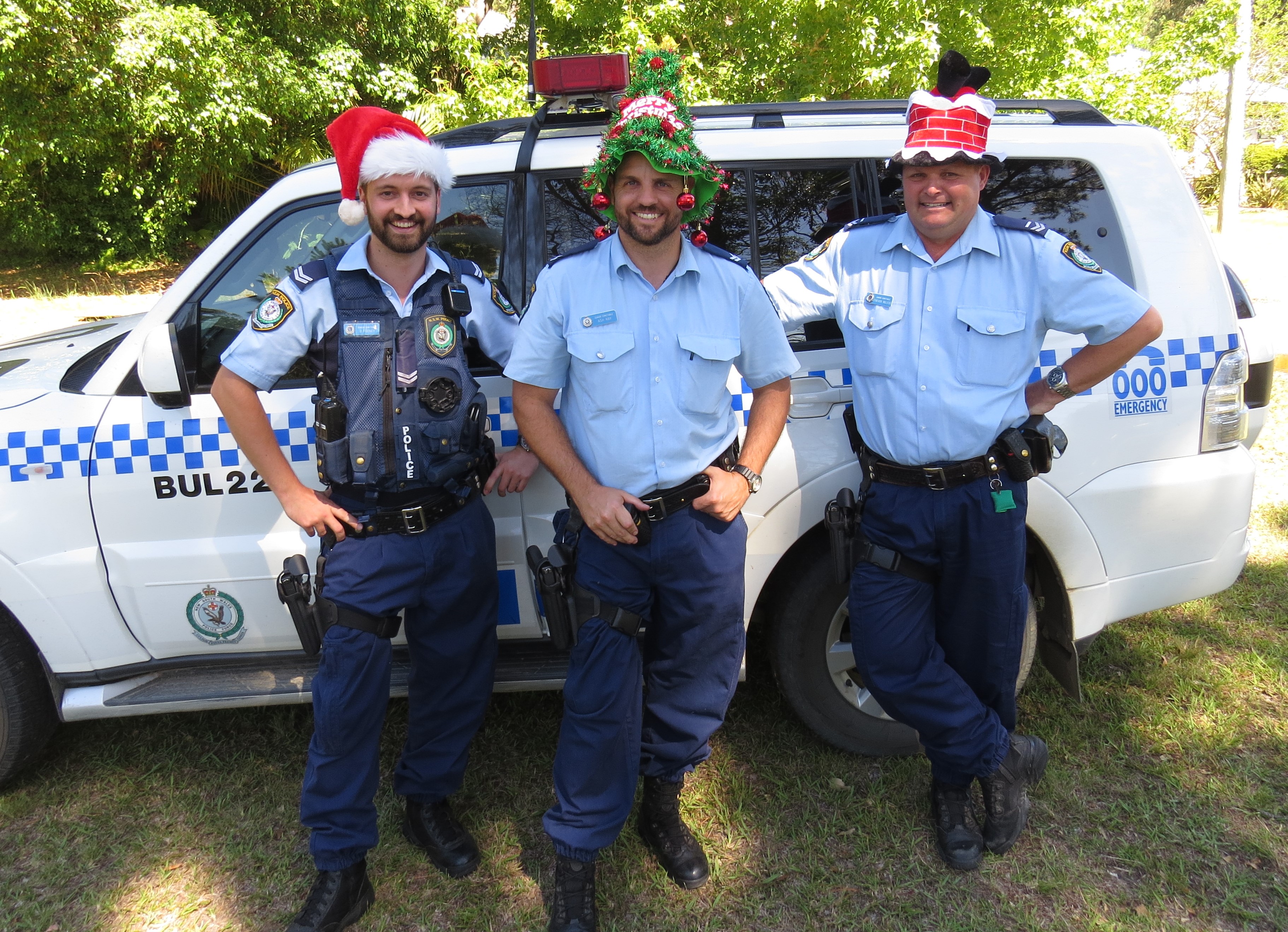 SEASONS GREETINGS: Police Senior Constables David Feeney, Ashley Ray and Trevor McLeod wish everyone a safe and enjoyable Christmas