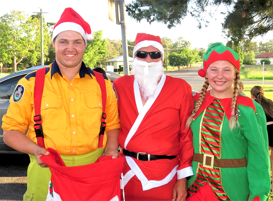 COMMUNITY CHRISTMAS: RFS members Jake Blanch and Meagan Terry with Santa.