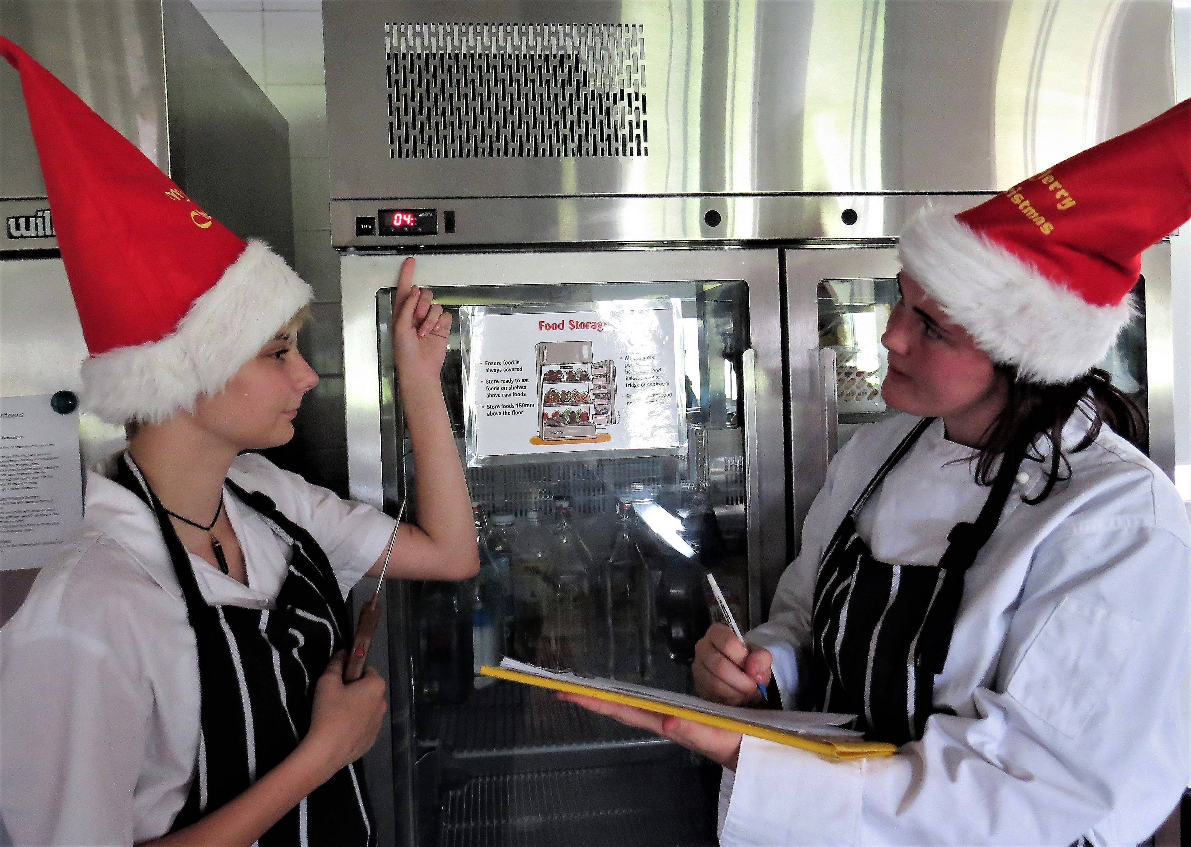 COLD STORAGE: Natasha Collins-Charlton and Tia King-Stow monitor the temperature of the refrigerator