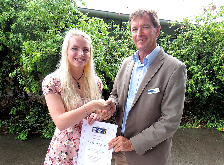 SCHOLARSHIP: Mckelty Searle accepts her award from Great Lakes Education Fund Chairperson Stephen Nicholas.