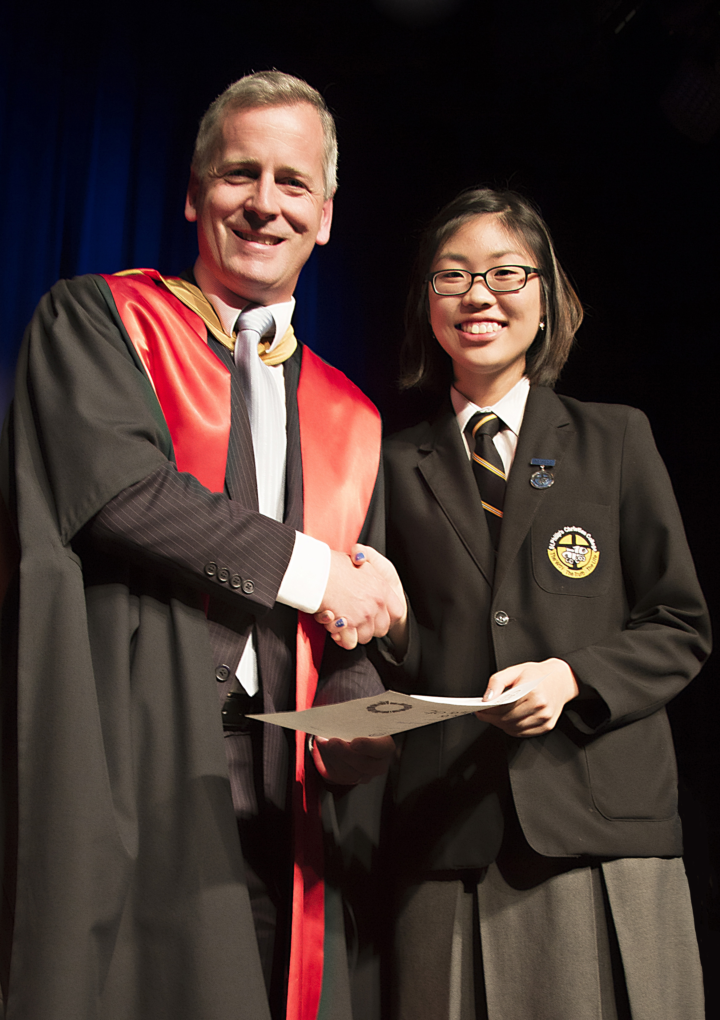 Grace Kim receiving her 2016 Dux Award from Principal Dr Pettersen.  Photo supplied by St Philip’s Christian College.