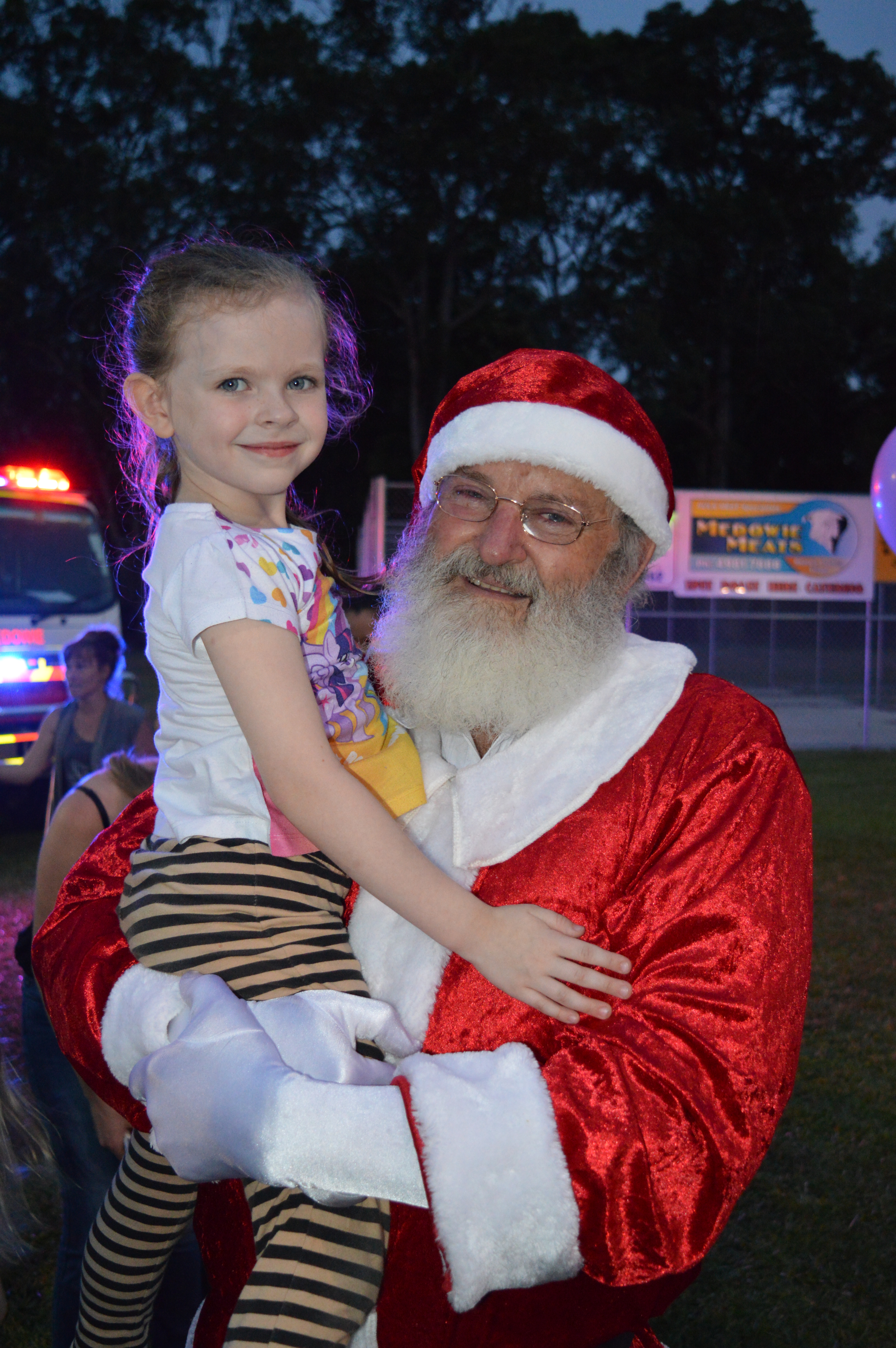  Katy Dingle meets Santa Claus at the Carols.
