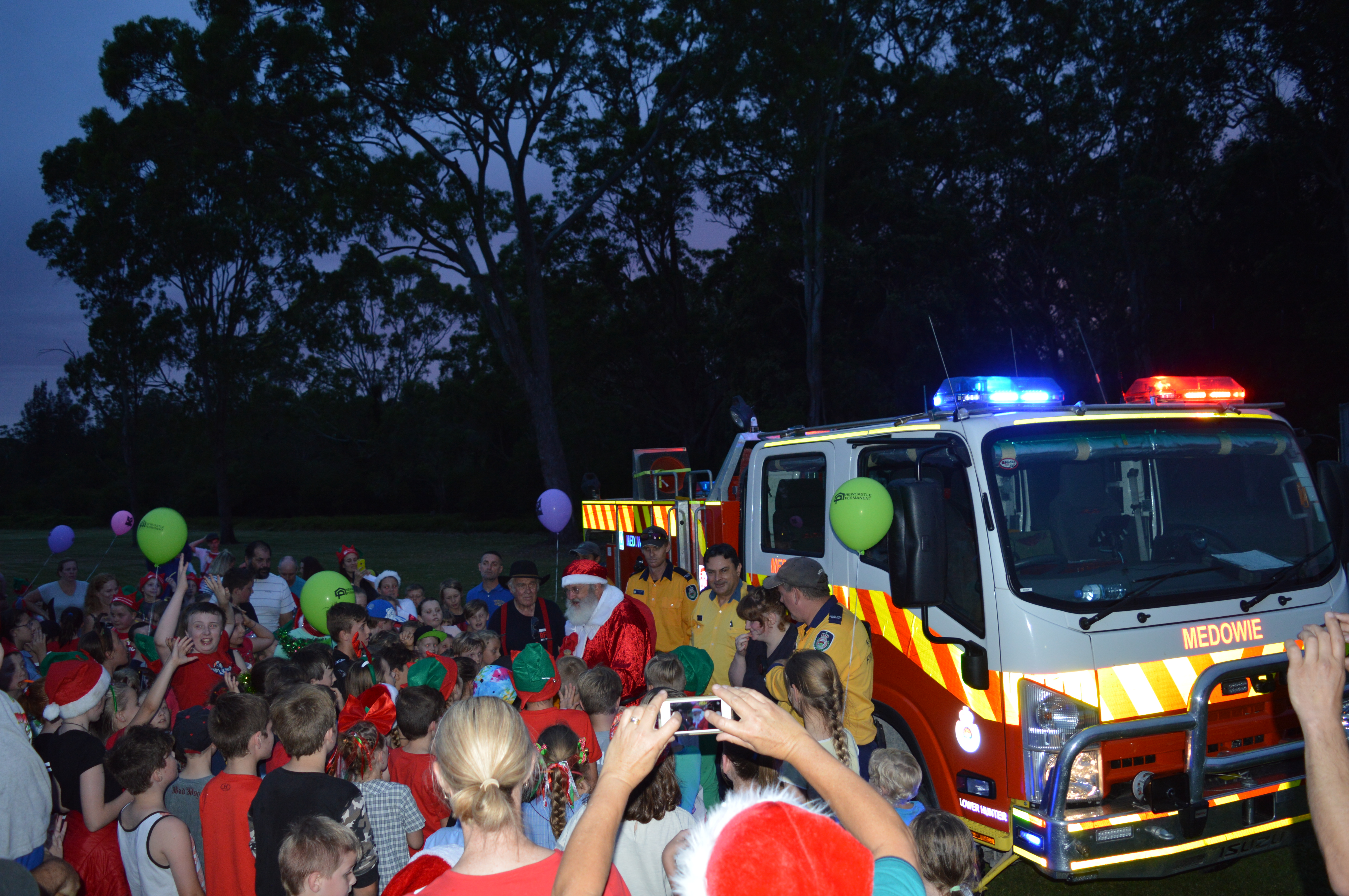 Santa swamped by Medowie children, and the not so young!