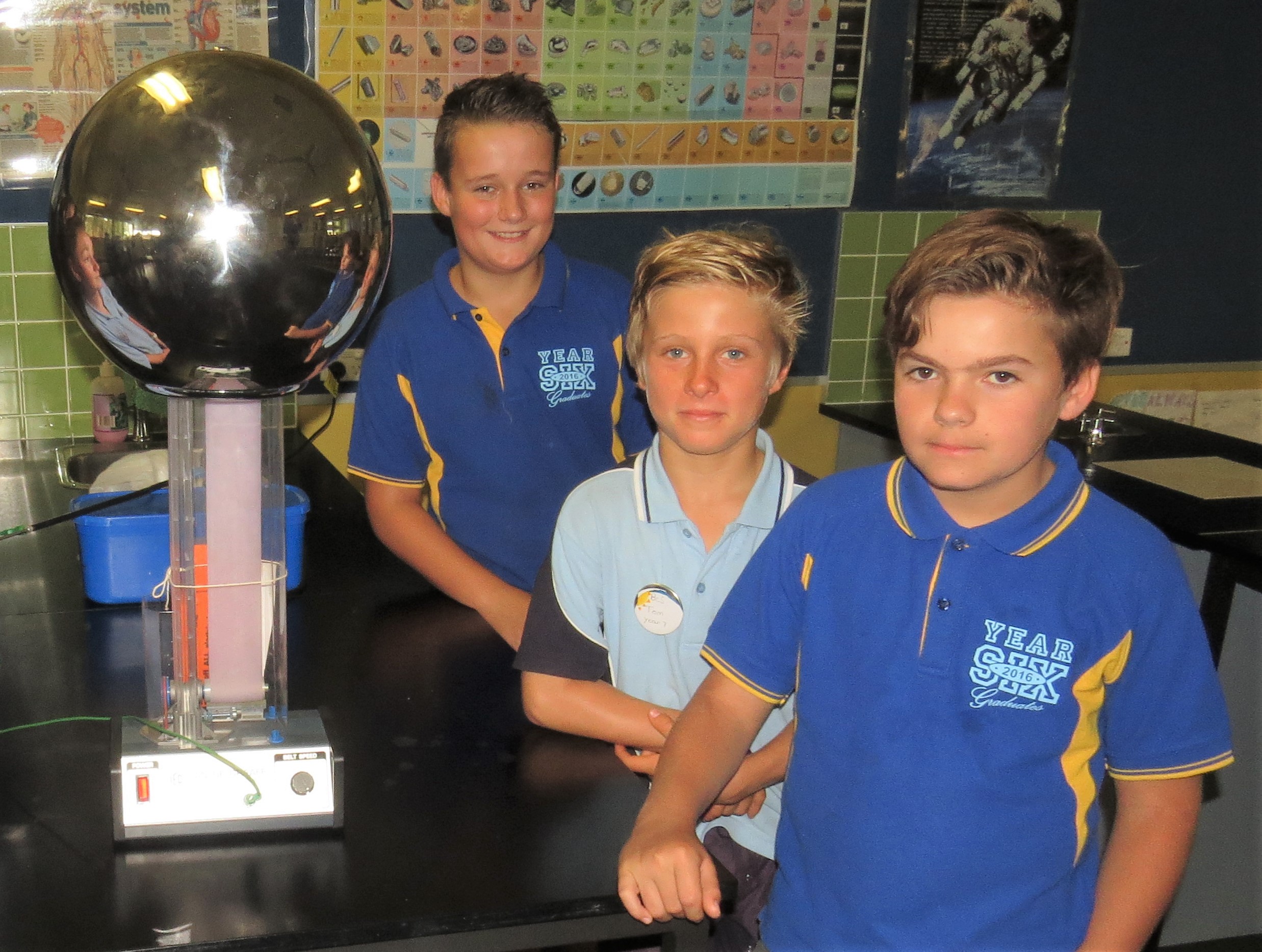SCIENCE: Jarryd Schmidt, Tom McInerney and Austin Battle experiment with a static electricity ball. 