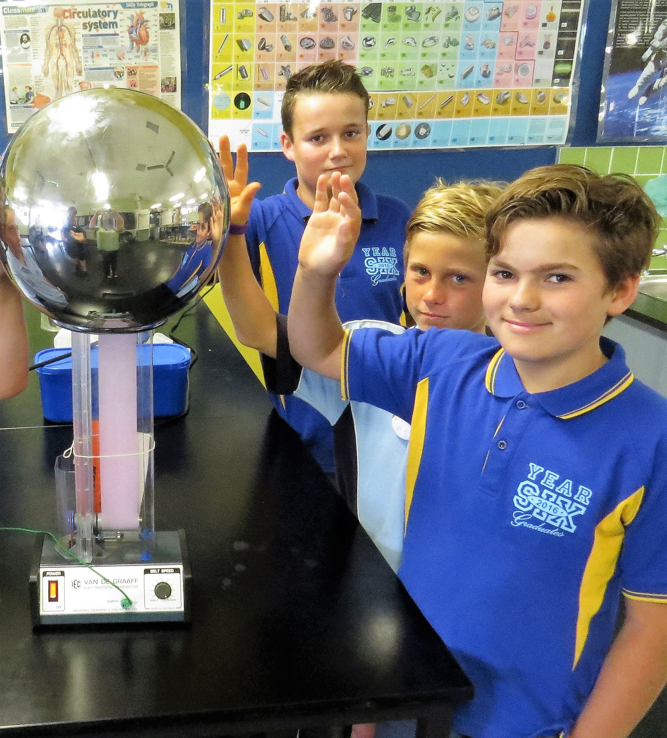 SCIENCE: Jarryd Schmidt, Tom McInerney and Austin Battle experiment with a static electricity ball.  
