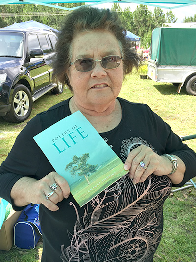Author Gwenda Cousin with her book ‘Poetry of Life’ at Medowie Markets last week