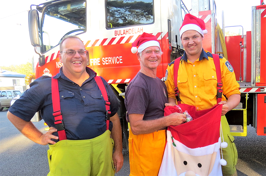 FESTIVE SPIRIT: Brigade Captain Mark Hartwell with Graham Rowell and Jake Blanch.  