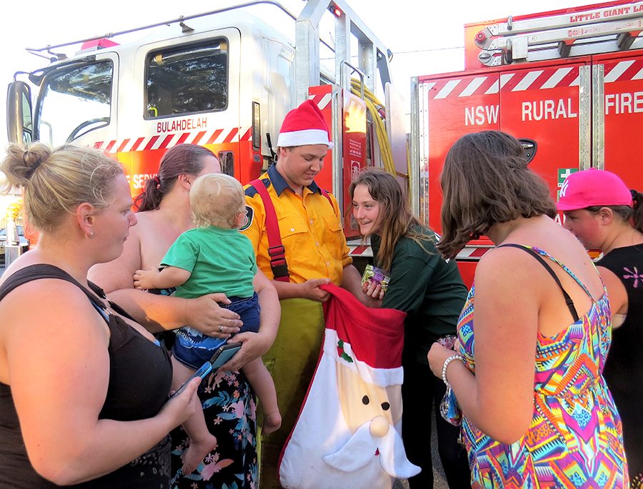 FESTIVE SPIRIT: RFS member Jake Blanch shares Christmas treats with the community.