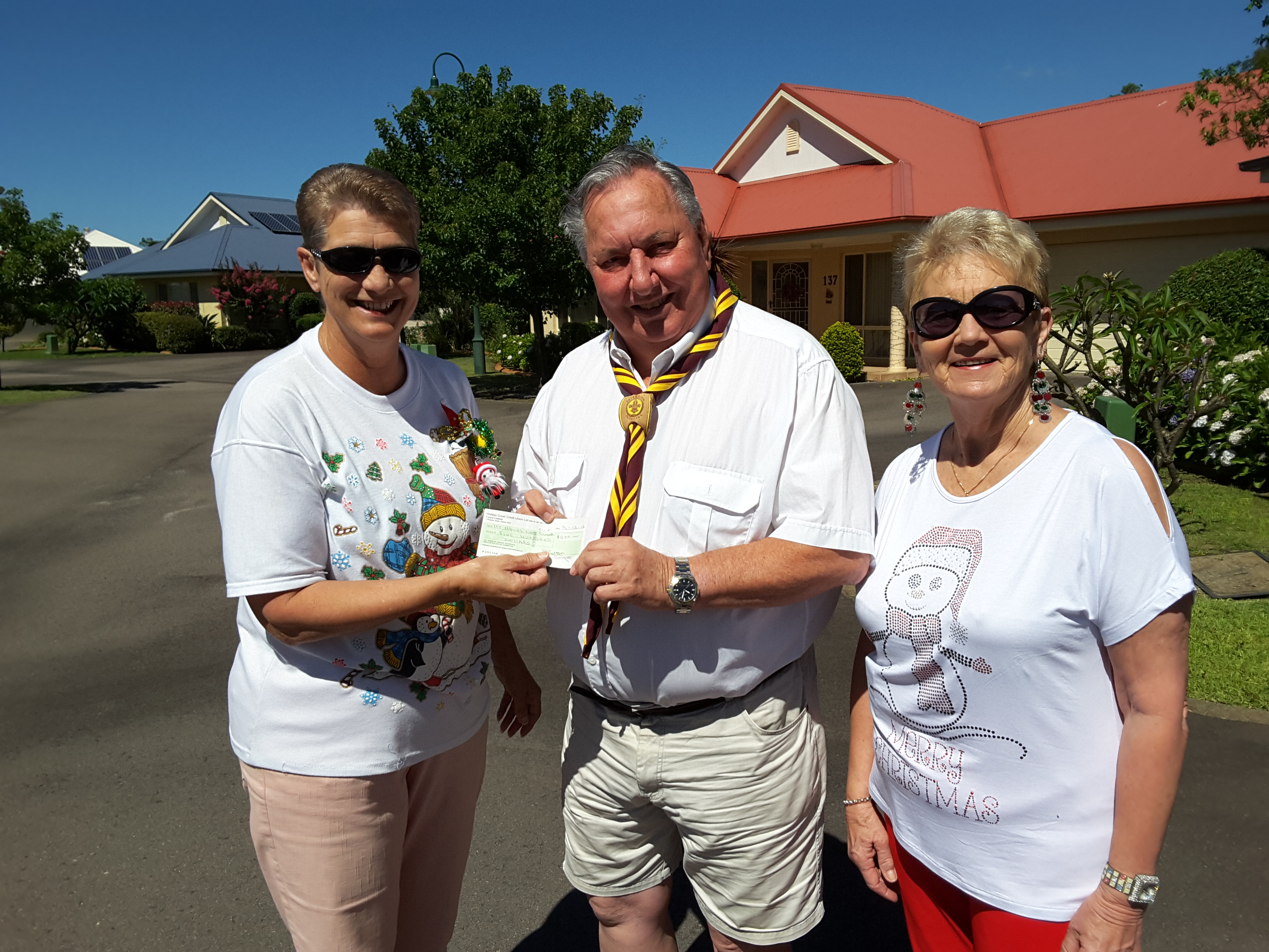 $500 presented to Neil Renfrew for 1st Hawks Nest Scout Group by Mary Cooper and Lynda Curran.
