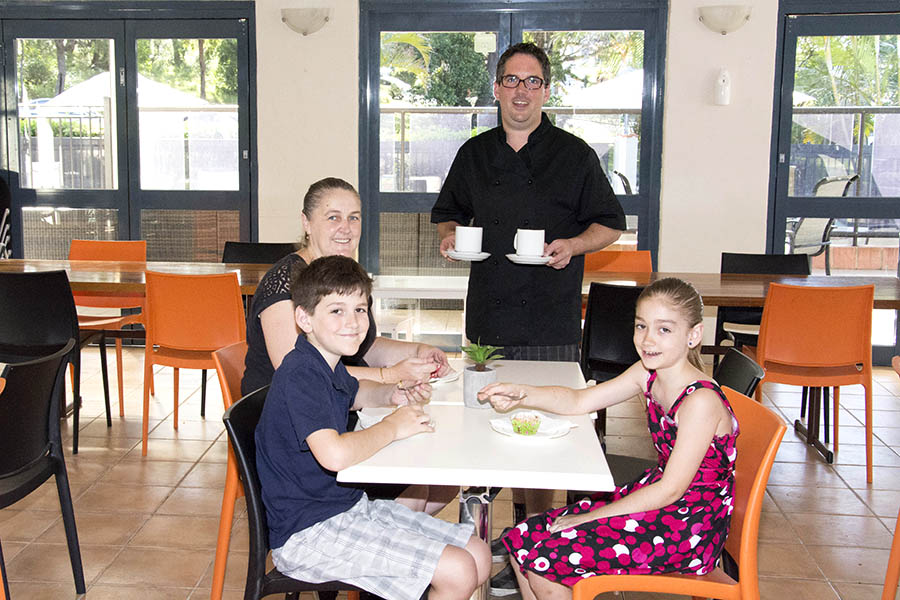 The Nicolls family enjoying morning tea at Eat’s @ Bay Breeze cafe. Ben and Chelsea Nicolls enjoying freshly made muffins whilst mum Kylie and dad Guy Nicolls enjoy freshly made coffee. Photo by: Square Shoe Photography