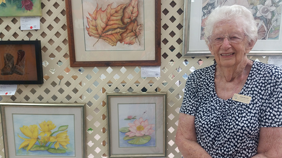 FOUNDING MEMBER: Joan Wilcox with two of her watercolours.