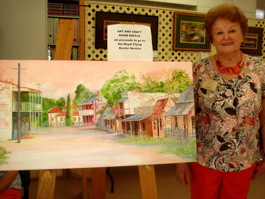 DONATED ARTWORK: Artist Heather Baker with her painting of Sofala.