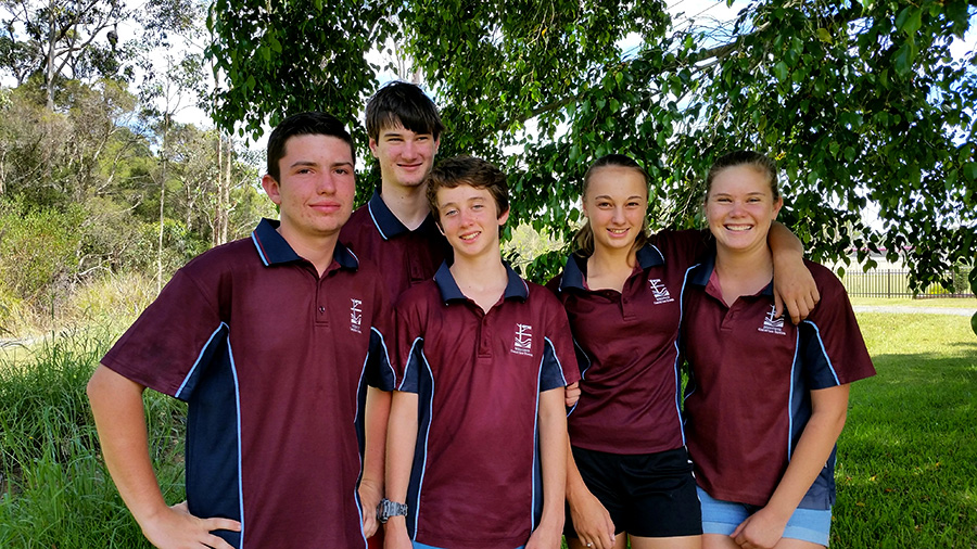 Jade Kehr, Ashley Craddock, Jackson Kennedy and Alec and Levi Warncke working hard on their school holidays to raise funds for their trip.