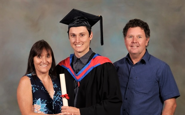GRADUATION DAY: Mitchell Markham with his proud parents Karen and Bradford. 