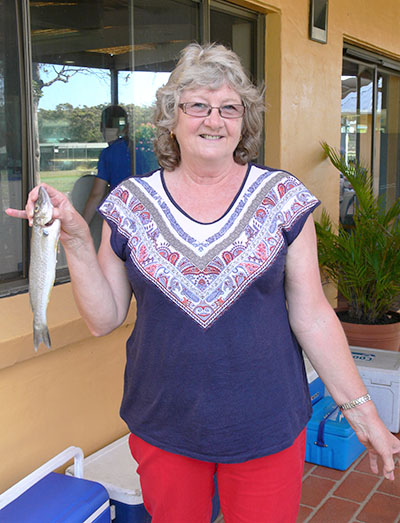 Marion Smith proudly displays the whiting she successfully angled.