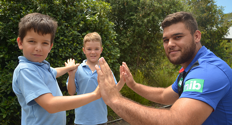 HIGH FIVE: Knights Keanu Dawson with Jack Browne and Korban Patteson.