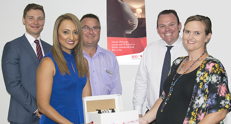 Back: Daniel Mueller, Product Manager, Jason Russell, Nelson Bay Bank Manager, James Cudmore, State Manager, Front: Safia Deen, North Coast Regional General Manager and Rebecca Nulty receiving a gift pack for her baby to be. Photo by Square Shoe Photography