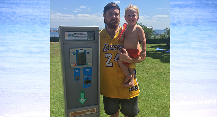 Trent Kemp pictured with son Kobe has had enough of  locals having to pay for parking. Photo by Jewell Drury 