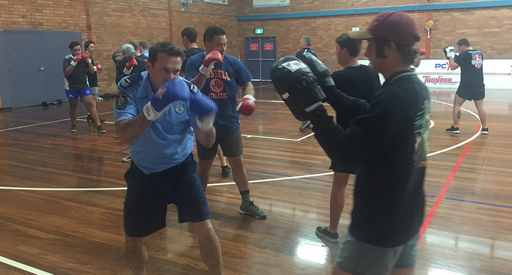 Youth and Police get into boxing training and strengthen their relationship in the community. 