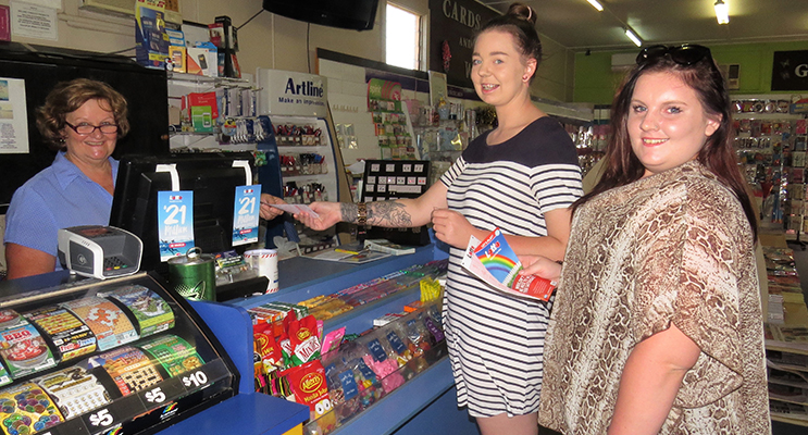 Bulahdelah Newsagent Sue Chick with customers Tiffany Wood and Maddie Harvey, hoping the local luck continues. 