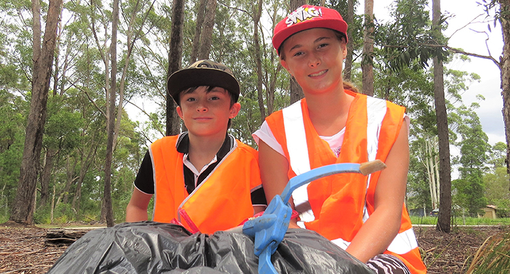 Clean Up Australia: Corey and Amber Cunningham clear rubbish to keep the area tidy. 