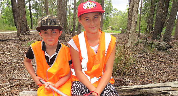 Clean Up Australia: Corey and Amber Cunningham clear rubbish to help keep the area tidy. 