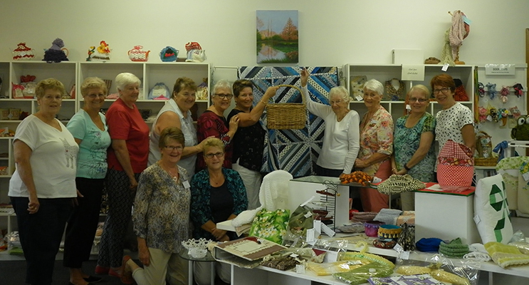 QUILTING & SEWING GROUP: June Wilcox draws the quilt raffle.