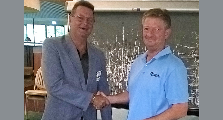 :   Allan Gleeson being congratulated by Richard Simmer, Hawks Nest Golf Club Secretary Manager, for winning the coveted Putt for Dough Jacket. 