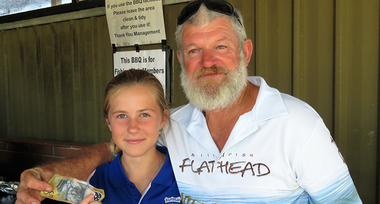 : Junior Champion Olivia Smith from Bulahdelah Fishing Club accepts her prize from Grant Bidgood. 
