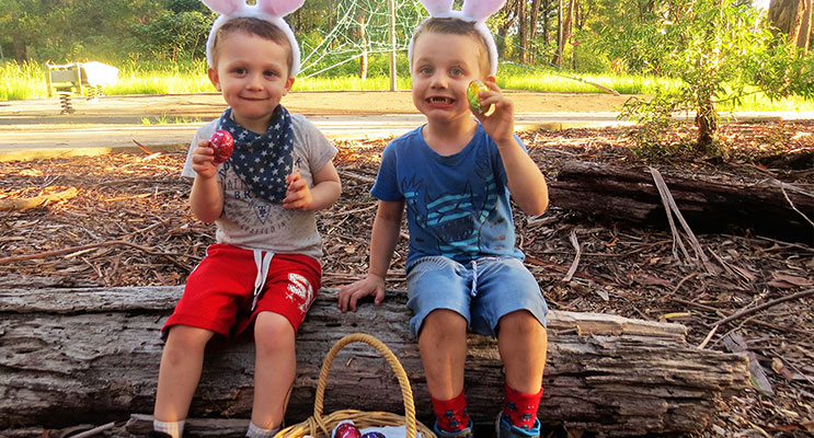Easter Egg Hunt: Nathan and Ethan Swann collect eggs left by the Easter Bunny. 