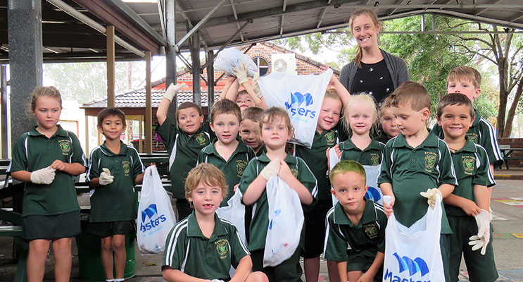 Clean Up Australia Day: Karuah PS K/1 students with teacher Miss Laura Blatch. 