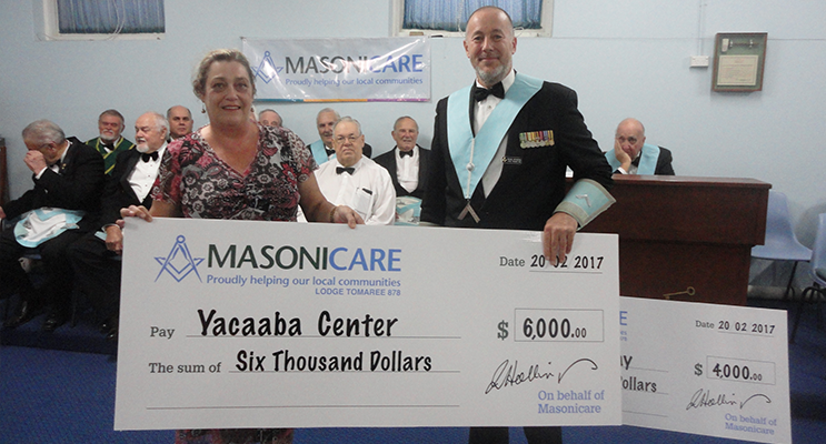 The Yacaaba Centre being presented with their cheque from Tomaree Lodge.